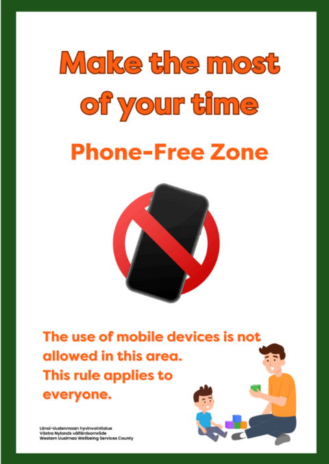 Sign image text translation: "Use your time wisely, phone-free zone. The use of mobile devices in this area is prohibited. Applies to people of all ages." At the bottom of the image, there is a drawing of a man and child playing with blocks.
